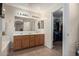 Bathroom with double sink vanity and open closet at 221 N 151St Ave, Goodyear, AZ 85338