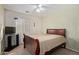 Bedroom featuring a ceiling fan and TV at 221 N 151St Ave, Goodyear, AZ 85338