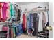 Walk-in closet with ample storage and organized clothing racks at 221 N 151St Ave, Goodyear, AZ 85338