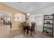 Dining area with wood table and chairs, lots of natural light, and tile floors at 221 N 151St Ave, Goodyear, AZ 85338