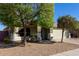 Front exterior view of a single-story home with a two-car garage at 221 N 151St Ave, Goodyear, AZ 85338