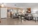 Open-concept living room featuring neutral colors and bright natural light at 221 N 151St Ave, Goodyear, AZ 85338