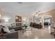 Bright and airy living area with tile flooring and open dining space at 221 N 151St Ave, Goodyear, AZ 85338