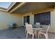 Covered patio with tile flooring and patio furniture at 221 N 151St Ave, Goodyear, AZ 85338