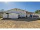 Expansive backyard featuring storage sheds, patio area, and potential for outdoor activities and entertainment at 2338 W Lupine Ave, Phoenix, AZ 85029