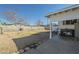 Enclosed backyard with partial patio, gravel landscape, and block fence at 2338 W Lupine Ave, Phoenix, AZ 85029