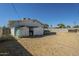 Large backyard featuring storage sheds, surrounded by a block wall, offering ample space for various activities at 2338 W Lupine Ave, Phoenix, AZ 85029