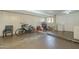 Spacious basement area with bikes, tool storage, and cement flooring at 2338 W Lupine Ave, Phoenix, AZ 85029