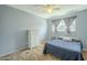 Bright bedroom featuring a bed, dresser, and a window for natural light at 2338 W Lupine Ave, Phoenix, AZ 85029