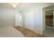 Cozy bedroom featuring ample closet space with a small ensuite bathroom area at 2338 W Lupine Ave, Phoenix, AZ 85029