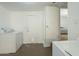 Functional laundry room with washer, dryer, and access to other rooms at 2338 W Lupine Ave, Phoenix, AZ 85029