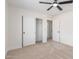 A bedroom featuring a ceiling fan and closet with sliding doors at 23407 W Ashleigh Marie Dr, Buckeye, AZ 85326