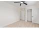 A bright bedroom featuring a ceiling fan and closet with sliding doors at 23407 W Ashleigh Marie Dr, Buckeye, AZ 85326