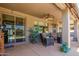 Relaxing covered patio with seating and plants, offering outdoor enjoyment and shade at 24413 S Lakeway Sw Cir, Sun Lakes, AZ 85248