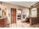 Luxurious main bathroom featuring dual vanities, a walk-in shower, and access to a spacious walk-in closet at 24413 S Lakeway Sw Cir, Sun Lakes, AZ 85248