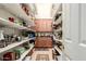 Walk-in pantry featuring ample shelving space for organized storage and easy access to kitchen essentials at 24413 S Lakeway Sw Cir, Sun Lakes, AZ 85248