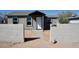 Charming exterior view of a single-story home featuring block wall and tidy landscaping at 246 E Central Ave, Coolidge, AZ 85128