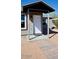 Inviting front entrance of home with a covered porch, painted posts, and wooden walkway at 246 E Central Ave, Coolidge, AZ 85128