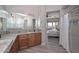 Bathroom featuring granite countertops, wood cabinets, and a view to the main bedroom at 27709 N 129Th Ln, Peoria, AZ 85383