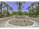 Scenic view of the Kiva Club entrance featuring manicured landscaping and palm trees at 27709 N 129Th Ln, Peoria, AZ 85383