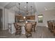 Open kitchen layout with granite countertops, stainless appliances and breakfast bar seating at 27709 N 129Th Ln, Peoria, AZ 85383