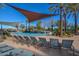 Luxury pool with lounge chairs, shade structures and beautiful landscaping at 27709 N 129Th Ln, Peoria, AZ 85383