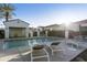 Community pool with lounge chairs and a covered seating area for residents to enjoy at 2777 W Queen Creek Rd # 13, Chandler, AZ 85248