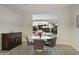 Bright dining room with modern chandelier, view of the water, and tile flooring at 2777 W Queen Creek Rd # 13, Chandler, AZ 85248