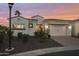 Front exterior of a well-kept home with a tile roof at sunset at 2777 W Queen Creek Rd # 13, Chandler, AZ 85248