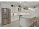 Bright, updated kitchen featuring stainless steel appliances, a stylish backsplash, and ample cabinet space at 2777 W Queen Creek Rd # 13, Chandler, AZ 85248