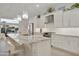 Modern kitchen featuring white cabinets, a granite island with seating, and stainless steel appliances at 2777 W Queen Creek Rd # 13, Chandler, AZ 85248