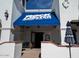 Exterior shot of the Rock Lobster restaurant entrance, featuring a bright blue awning at 2777 W Queen Creek Rd # 13, Chandler, AZ 85248