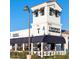 Exterior view of the restaurant Trophy, with outdoor seating under a dark blue awning at 2777 W Queen Creek Rd # 13, Chandler, AZ 85248