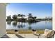 Charming backyard pond and patio featuring lush landscaping and calming fountain at 2777 W Queen Creek Rd # 13, Chandler, AZ 85248