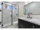 Modern bathroom featuring sleek black fixtures, walk-in shower, and elegant marble countertops at 29399 N 67Th Way, Scottsdale, AZ 85266