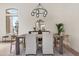 Bright dining area with natural light, a modern chandelier, and inviting decor at 29399 N 67Th Way, Scottsdale, AZ 85266