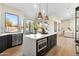 Open-concept kitchen with an island, perfect for entertaining, and views of the living space at 29399 N 67Th Way, Scottsdale, AZ 85266