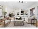 Bright and open living room with hardwood floors, neutral tones, and views into dining and kitchen areas at 29399 N 67Th Way, Scottsdale, AZ 85266