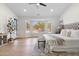 Relaxing main bedroom features a bay window with backyard views and a ceiling fan at 29399 N 67Th Way, Scottsdale, AZ 85266