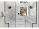 This shower features white marble, dual shower heads, and a built-in bench at 29399 N 67Th Way, Scottsdale, AZ 85266