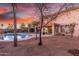 Backyard with a pool and an outdoor shed and covered patio at 29576 N Gecko Trl, San Tan Valley, AZ 85143