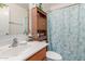 Cozy bathroom featuring a vanity, commode and linen shelving at 29576 N Gecko Trl, San Tan Valley, AZ 85143