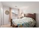 Cozy bedroom featuring a wooden bed frame and a bright window at 29576 N Gecko Trl, San Tan Valley, AZ 85143