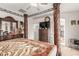 Bedroom with a mounted TV, walk-in closet, and decorative wood furniture at 29576 N Gecko Trl, San Tan Valley, AZ 85143