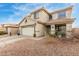 Charming two-story home with a well-manicured yard, two-car garage, and inviting front porch at 29576 N Gecko Trl, San Tan Valley, AZ 85143