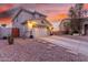 Charming two-story home with a well-manicured yard, two-car garage, and inviting front porch at 29576 N Gecko Trl, San Tan Valley, AZ 85143