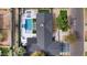 Aerial view of the backyard showcasing the pool, outdoor living spaces, and meticulous landscaping at 3033 E Roma Ave, Phoenix, AZ 85016