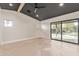 Airy bedroom with wood floors, ceiling fan, sliding glass door to patio and modern ceiling detail at 3033 E Roma Ave, Phoenix, AZ 85016