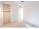 Bright bedroom features neutral carpet, a closet with sliding doors, and a modern light fixture at 34074 N Beeblossom Trl, San Tan Valley, AZ 85144