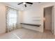 Bedroom with floating desk, window, and modern light fixture at 34074 N Beeblossom Trl, San Tan Valley, AZ 85144